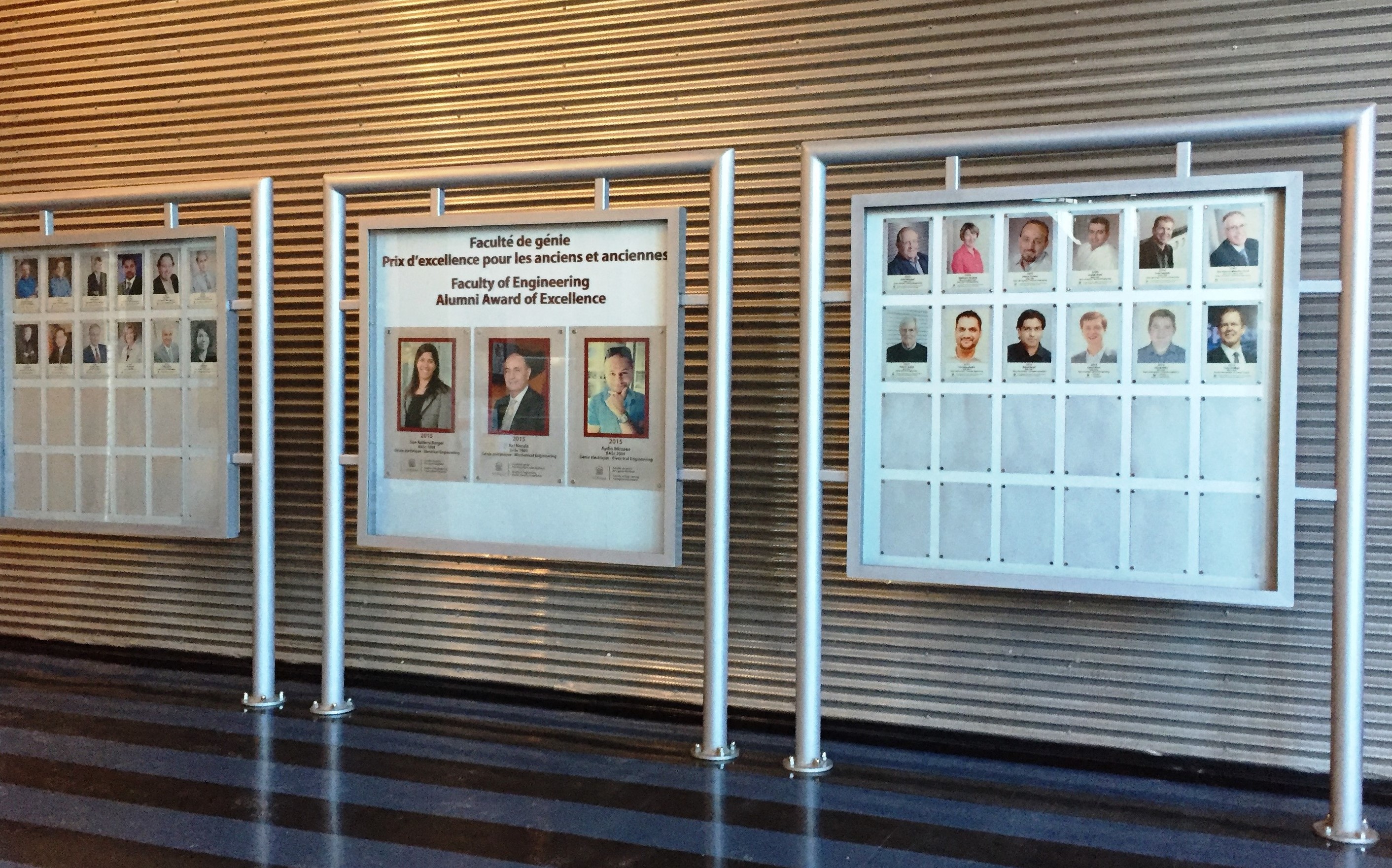 Photo of a hallway with faces on a sign