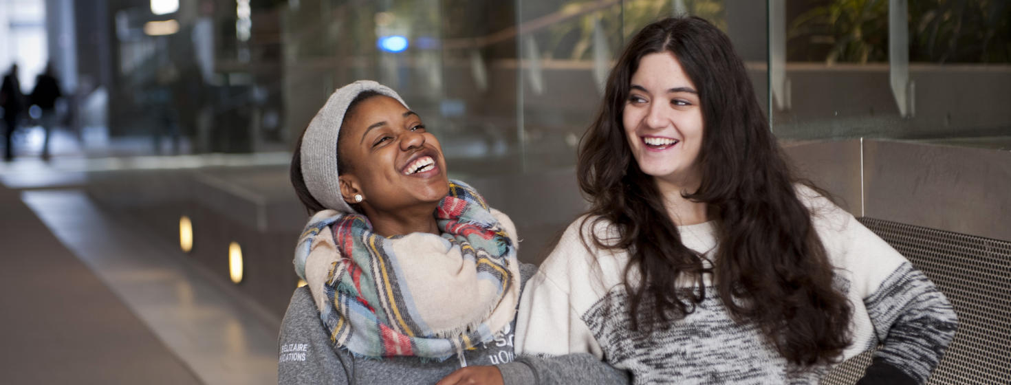 Two women smiling.
