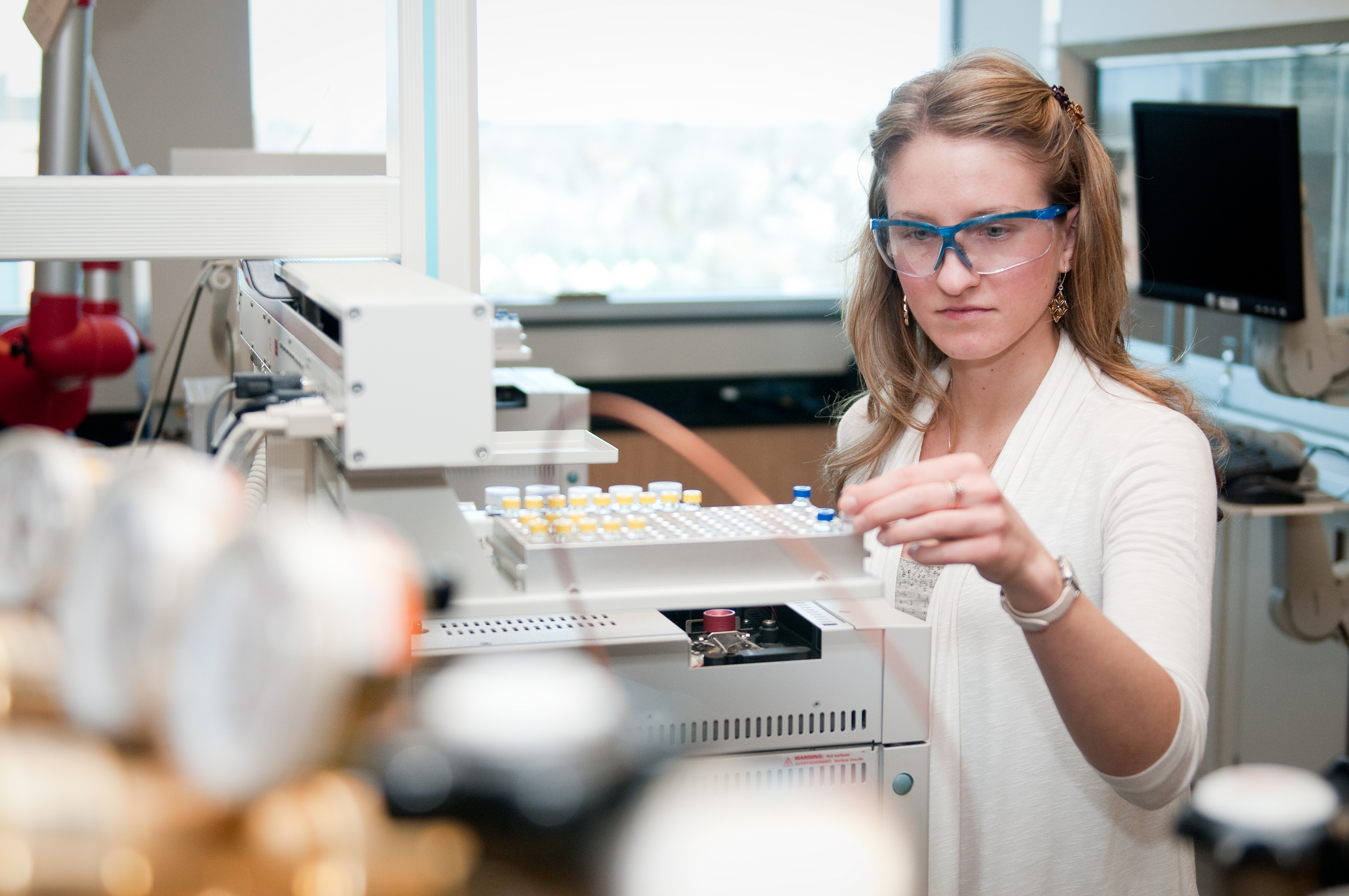 Student working in biotech lab.