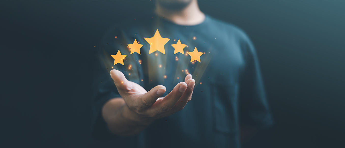 person holding 5 stars for excellence