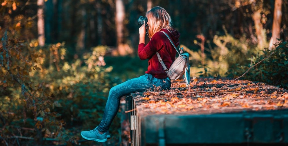Person taking photo in the wood
