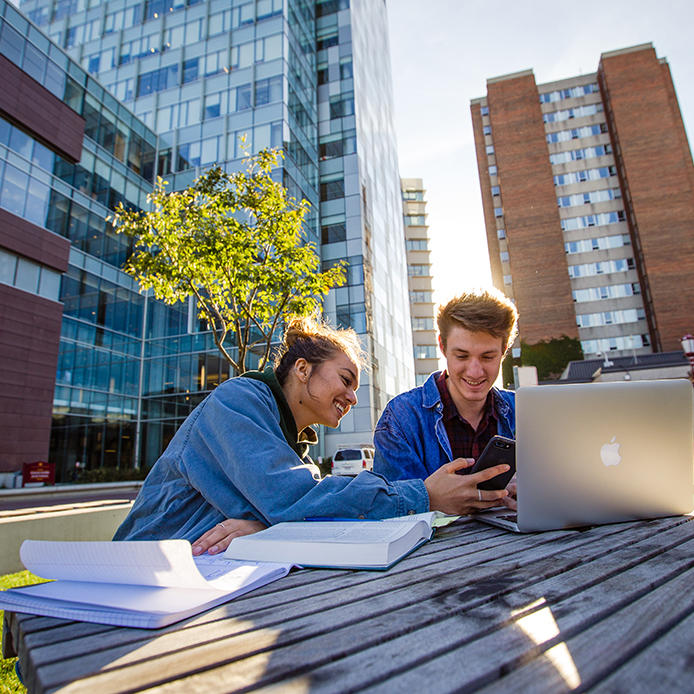 Students siting outside