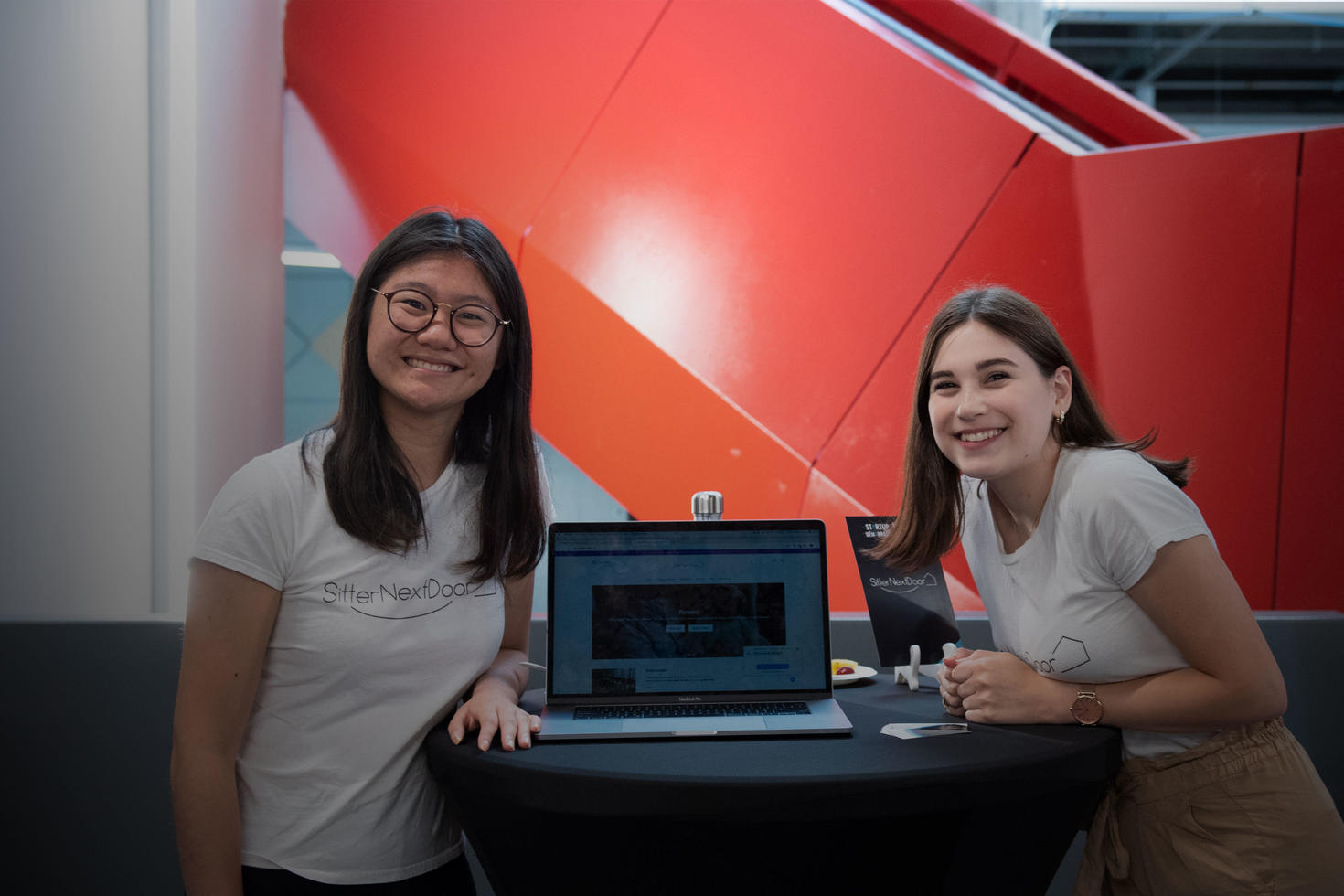 Two founders presenting on a laptop